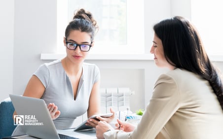 Two women considering a franchise looking at a laptop computer. 