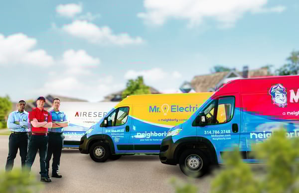 Aire Serv, Mr. Electric, and Mr. Rooter Plumbing franchise owners in front of vans