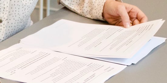 woman holding paperwork