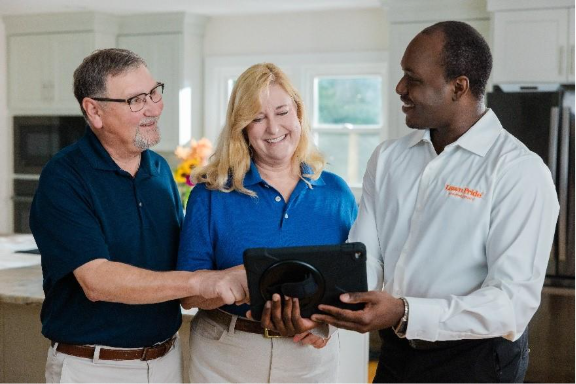 Lawn Pride Franchise Owner working with customers on Lawn Care plan